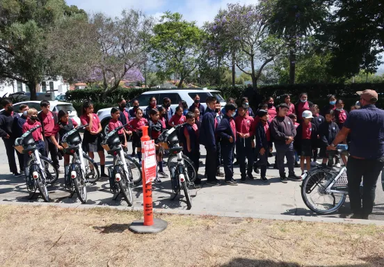 Kids receive a demonstration on bike safety at the 2022 Public Works Meet & Greet